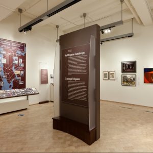 Intro panel with flip interactive in background – New-York Historical Society in collaboration with El Museo del Barrio and John Esposito Design Studio